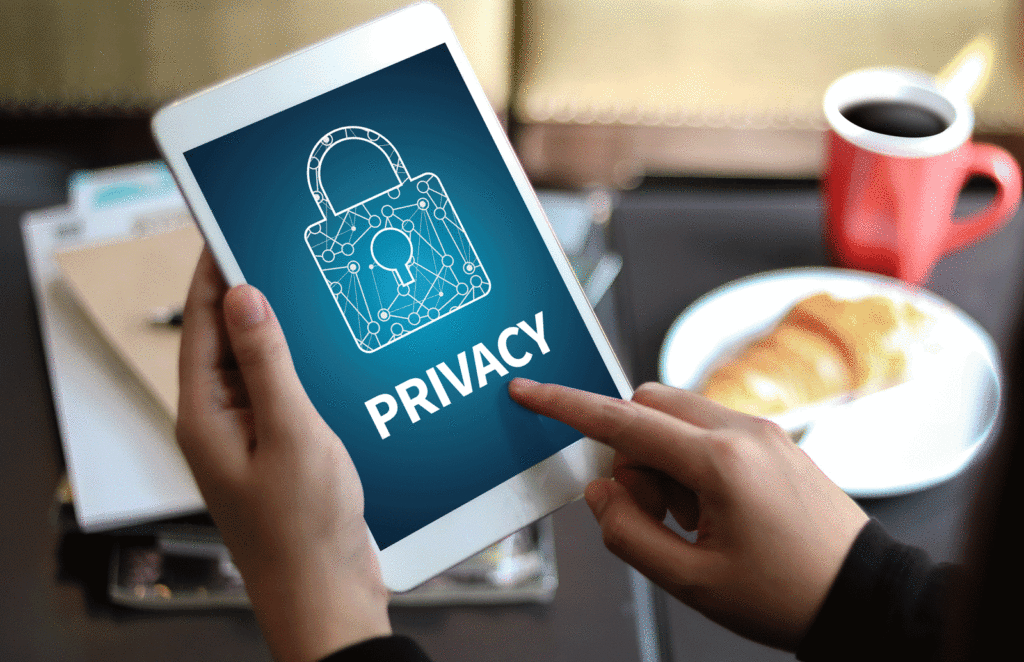 Person holding an ipad with the words privacy written on it