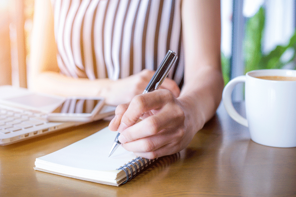 Woman taking notes in a notepad