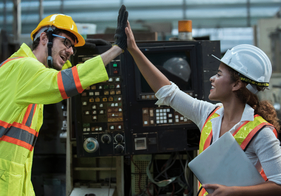 Two engineers high fiving